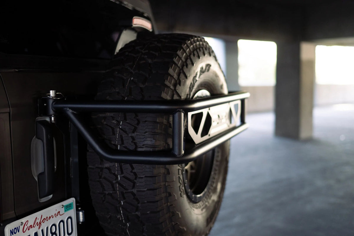 DV8 - DV8 Offroad 21 - 23 Ford Bronco Spare Tire Guard & Accessory Mount - Panda Motorworks