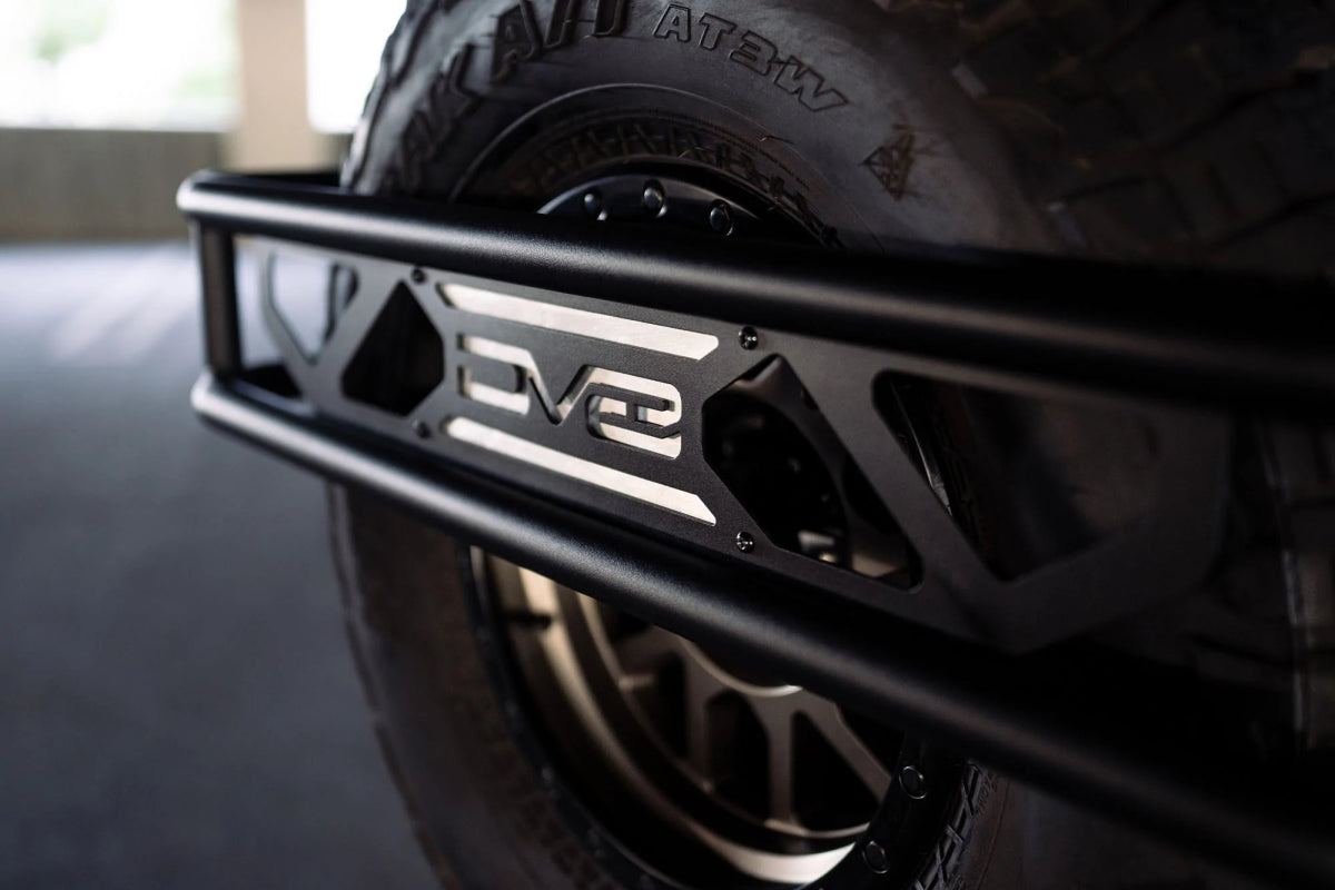 DV8 - DV8 Offroad 21 - 23 Ford Bronco Spare Tire Guard & Accessory Mount - Panda Motorworks