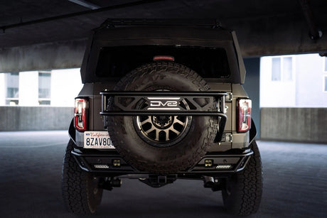 DV8 - DV8 Offroad 21 - 23 Ford Bronco Spare Tire Guard & Accessory Mount - Panda Motorworks